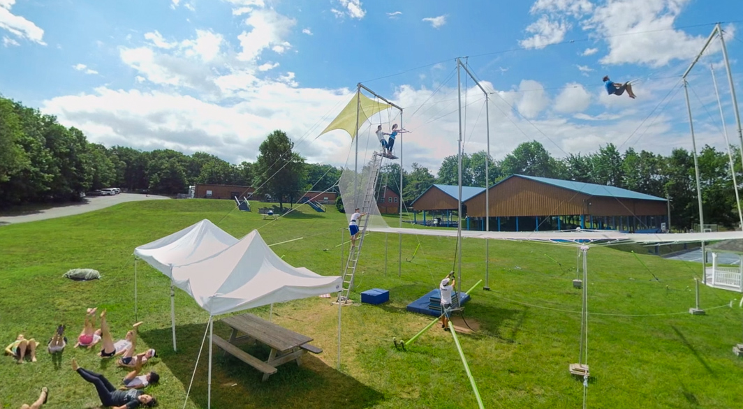 Campers stretching by trapeze